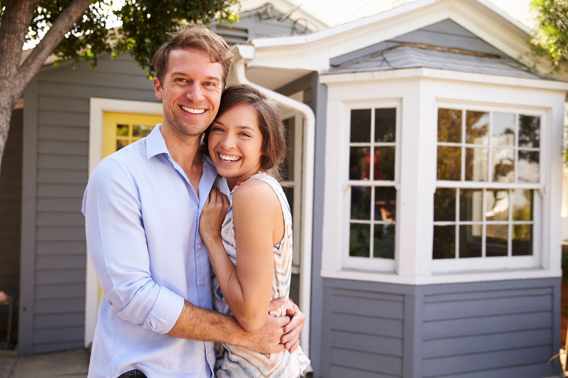 happy couple saving on home insurance