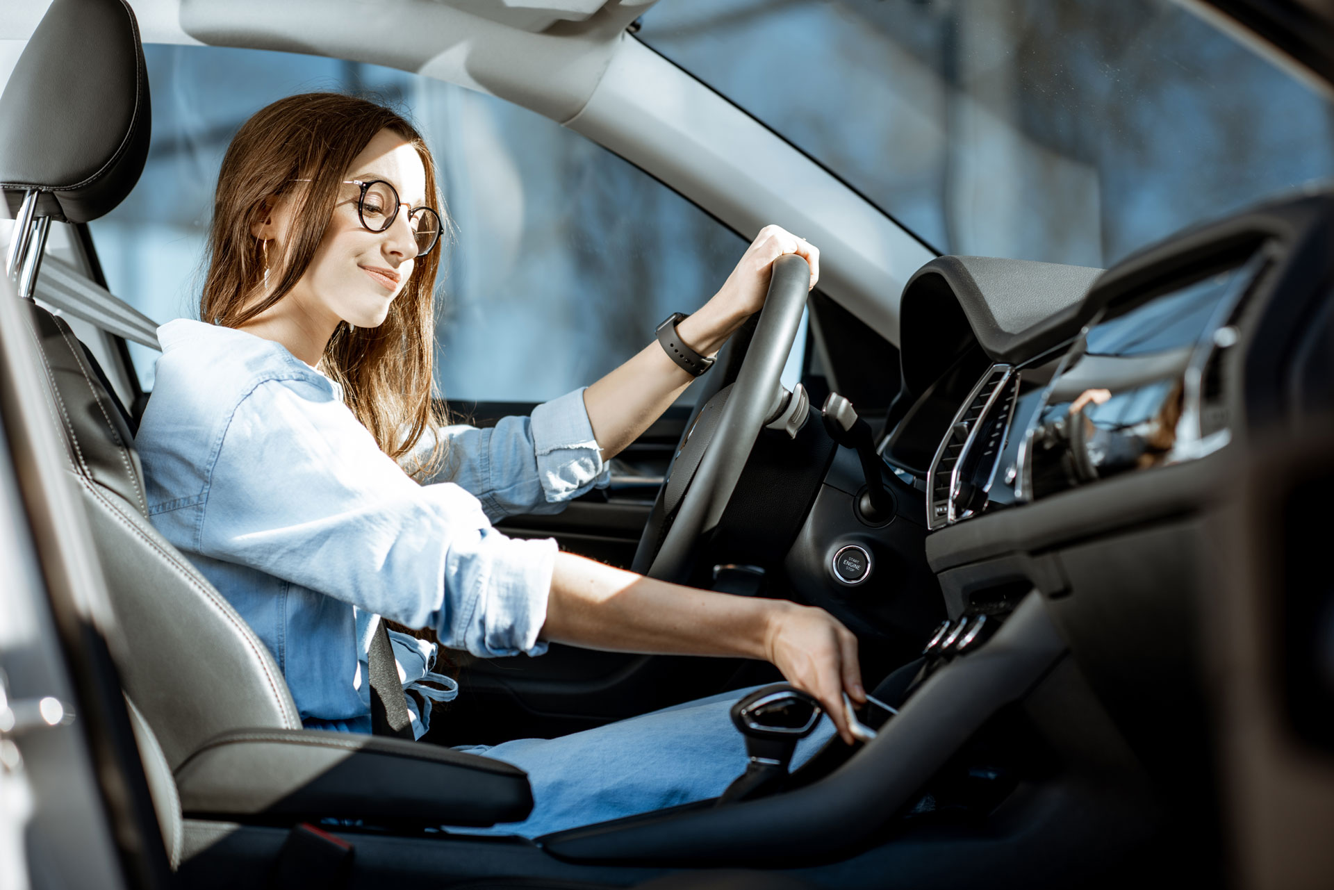 happy woman driving saving money in auto insurance