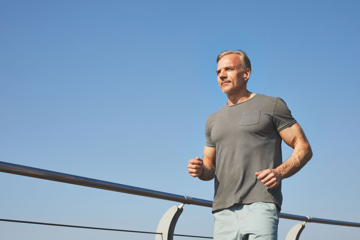 active mature man running outdoors