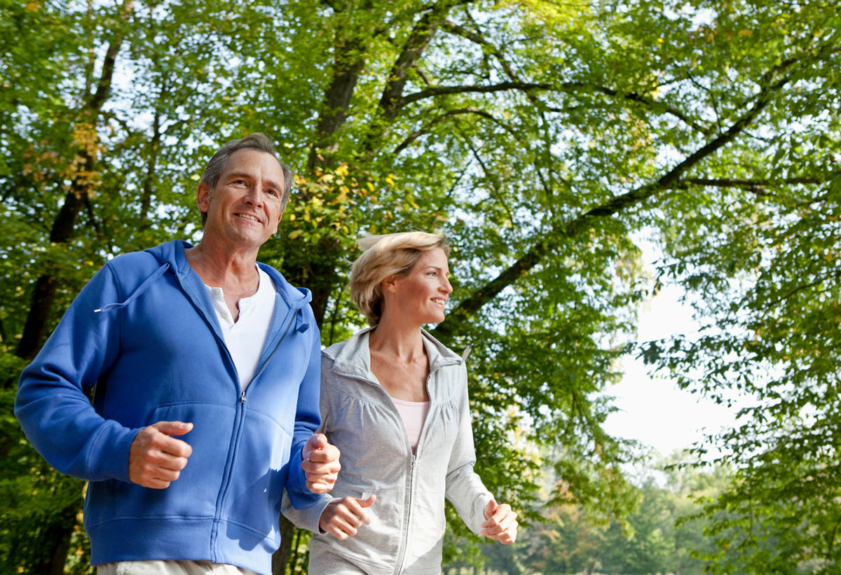 middle aged couple jogging